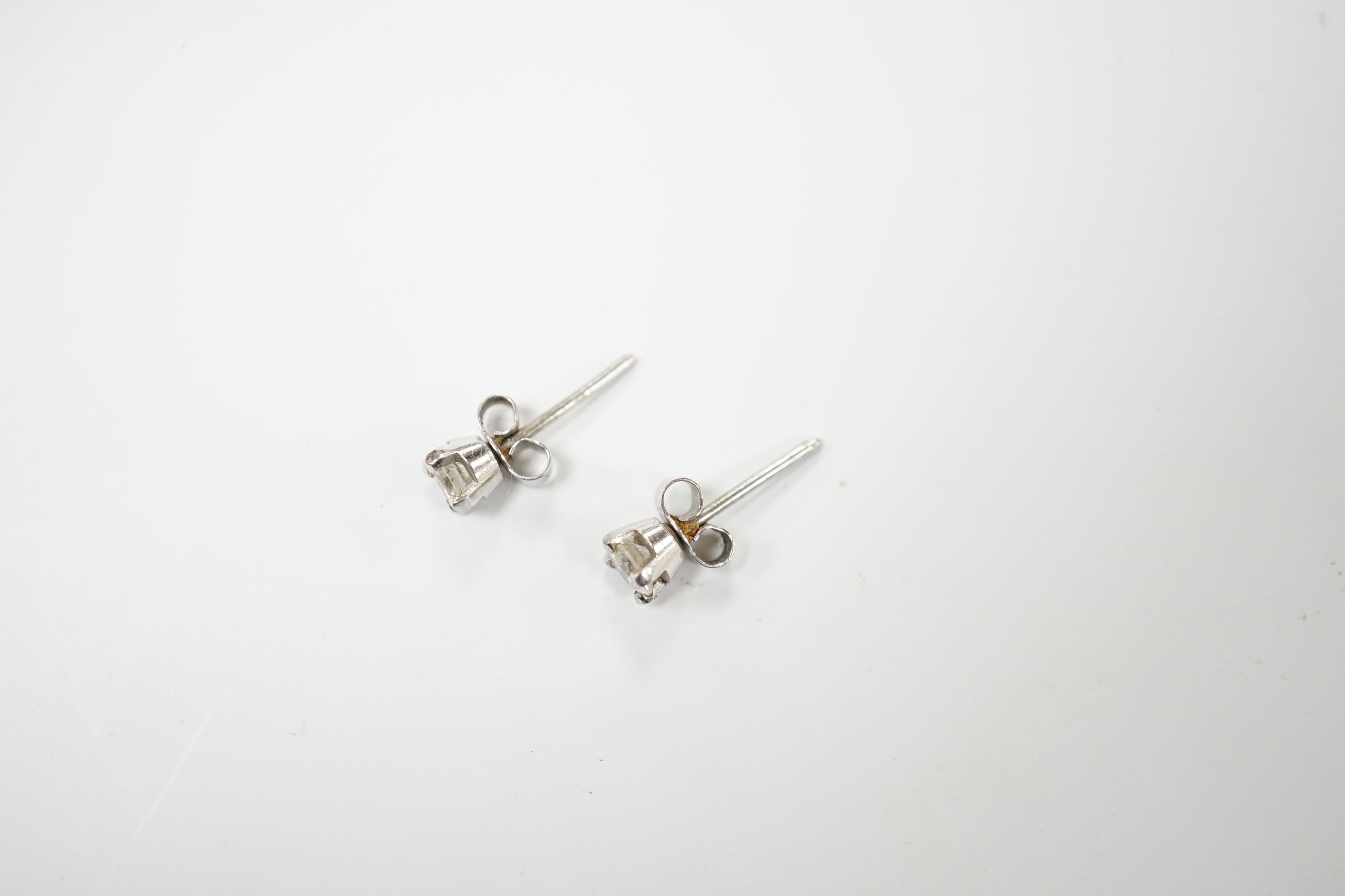 A pair of 9ct white gold solitaire diamond ear studs